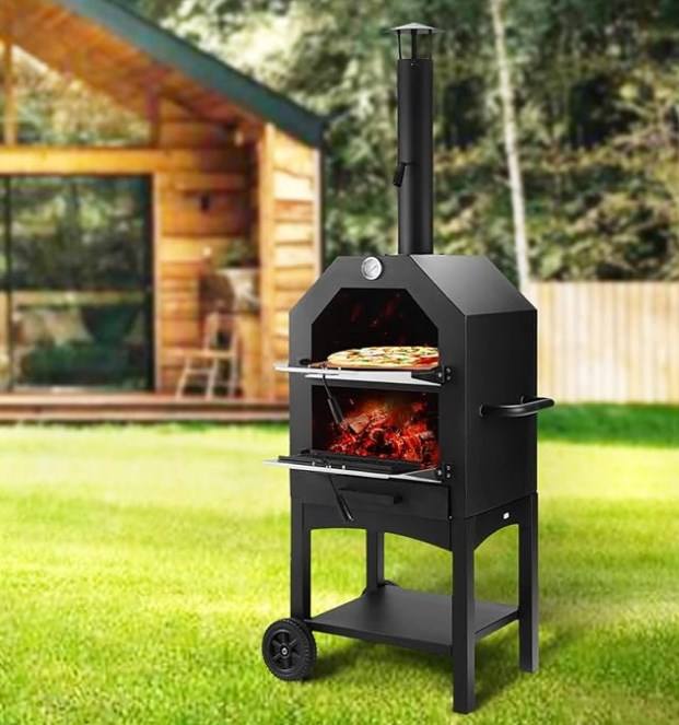 Freshly baked Neapolitan pizza inside a wood fired outdoor pizza oven